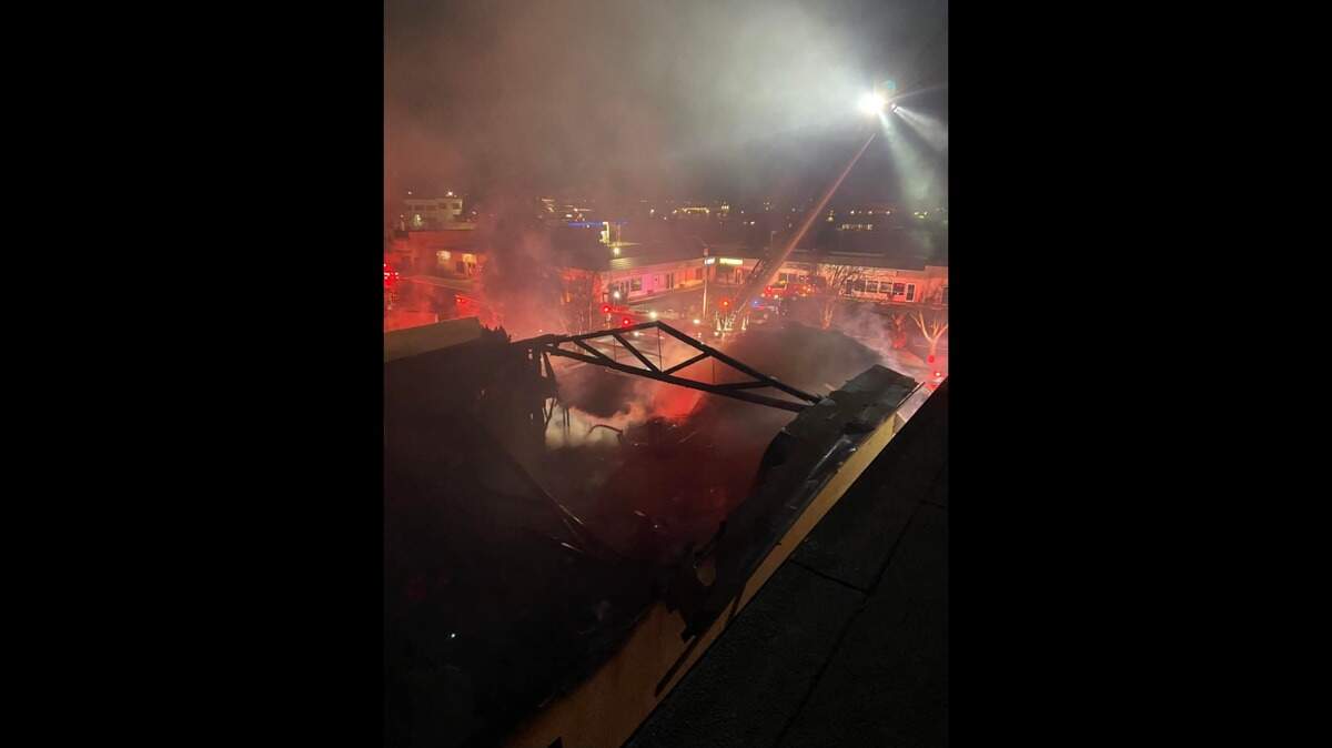 Crews extinguish a fire that burned an unoccupied building in the 300 block of North Center Street in Turlock, Calif. starting late Thursday, Feb. 24, 2022.