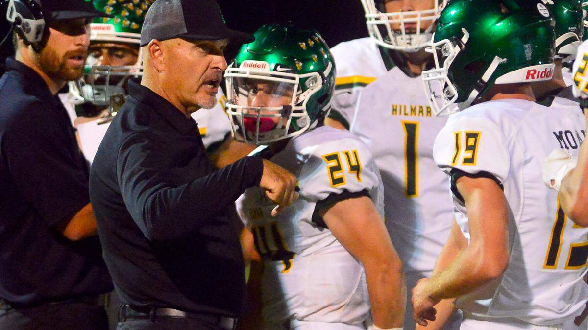 Hilmar Head Coach Frank Marques talks to his players during a timeout during a football game between Hilmar and Ripon High School at Ripon High School in Ripon CA on September 24, 2021