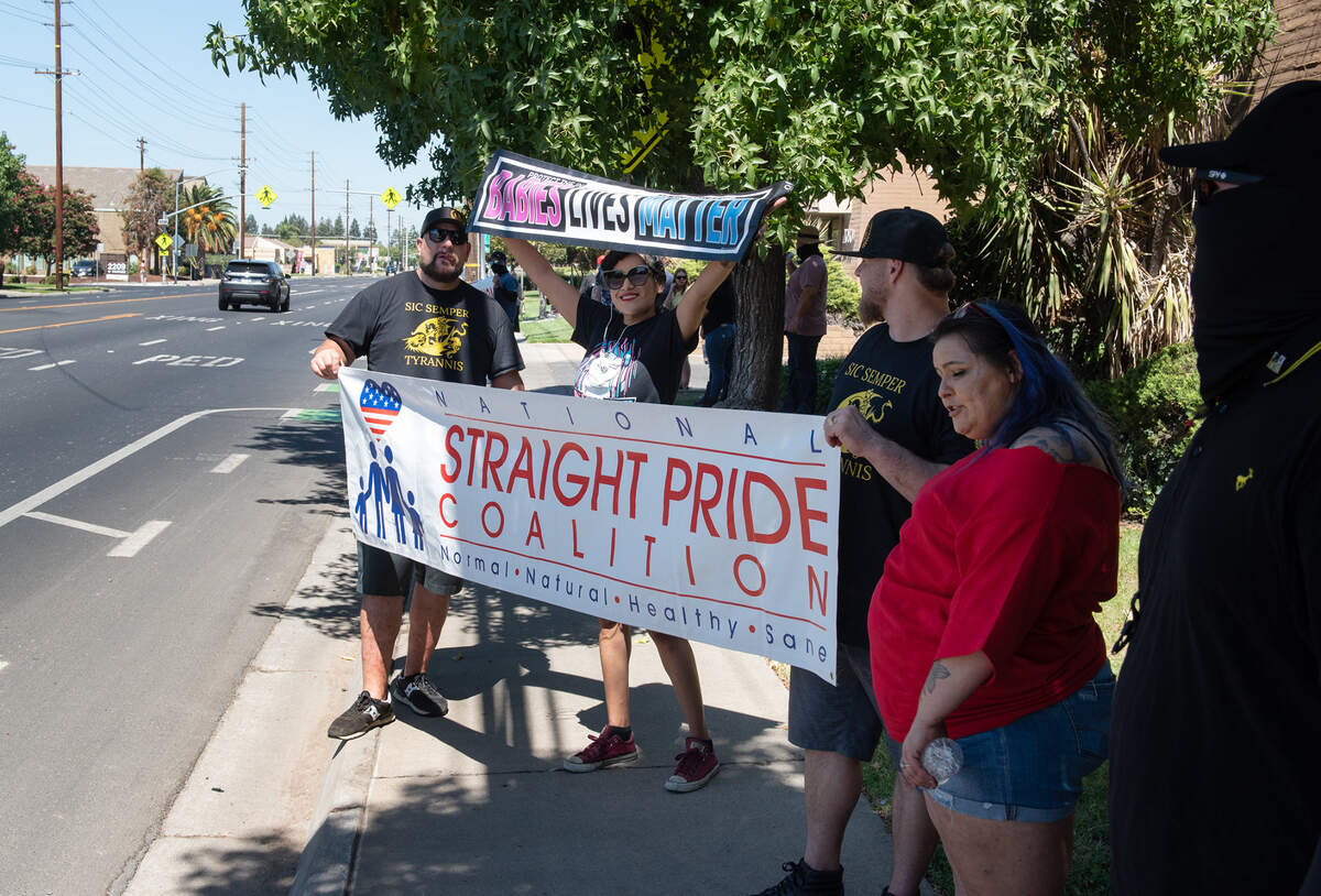 Straight Pride coalition members rally outside a family planning center on Coffee Road in Modesto, Calif., on Saturday, August 27, 2022.