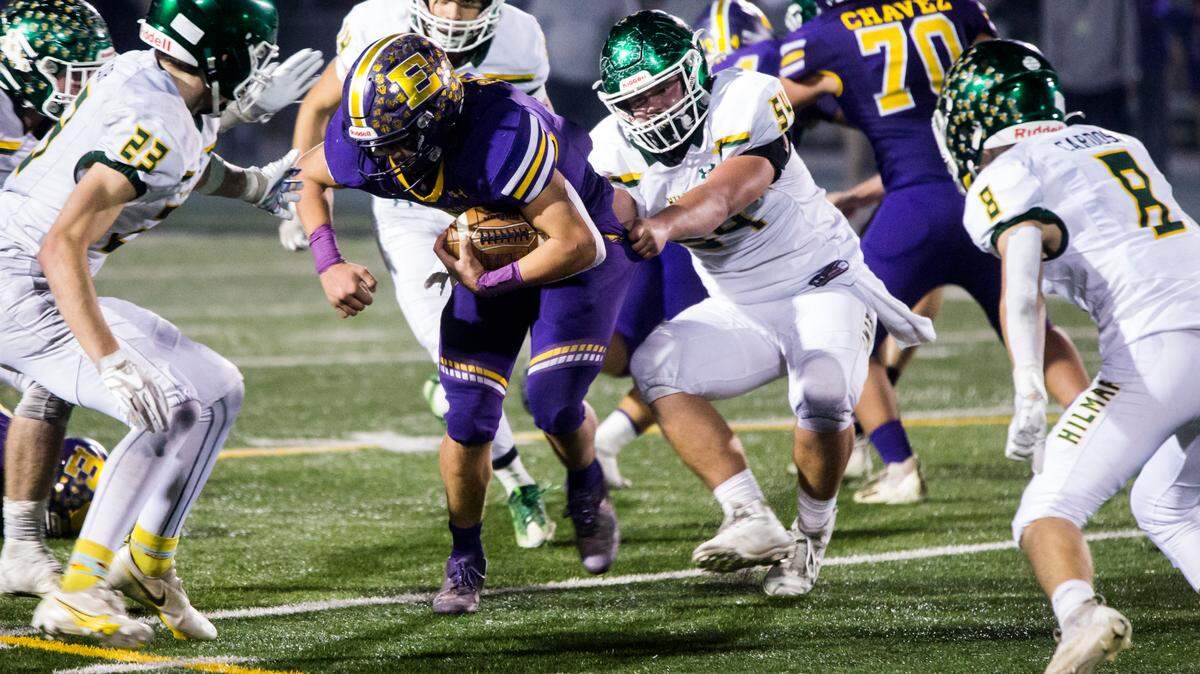 Escalon Highs Ryker Peters, 1, works his way through Hilmars defense. Escalon High School took on Hilmar High football during the 2021 CIF Sac-Joaquin Football Playoffs - Division V at Saint Mary’s High School in Stockton, Ca. Escalon came out on top as the champions with a 20-13 win over Hilmar.
