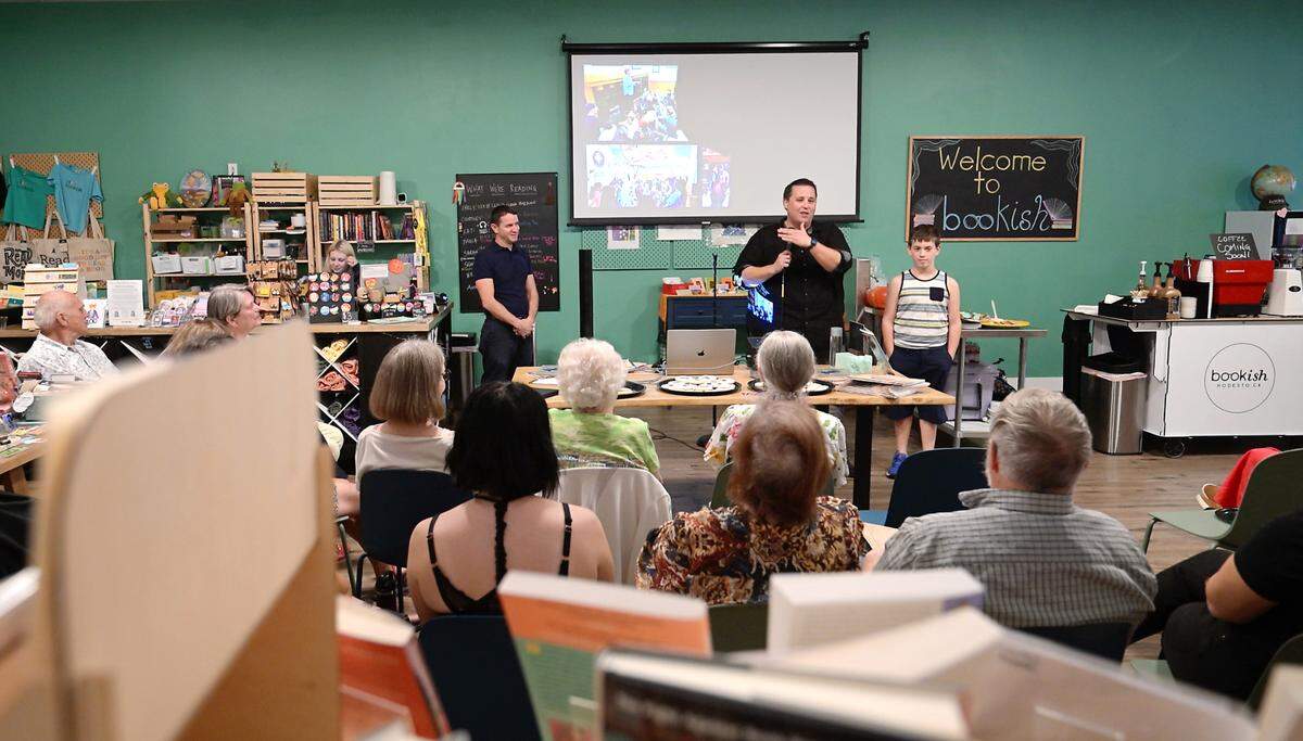 Author David Seymour speaks to a crowd gathered for the book launch for “StaniStory: Change and Continuity in Stanislaus County,” by Seymour and Keith Highiet, at Bookish bookstore in Modesto, Calif., Wednesday, Oct. 2, 2024.