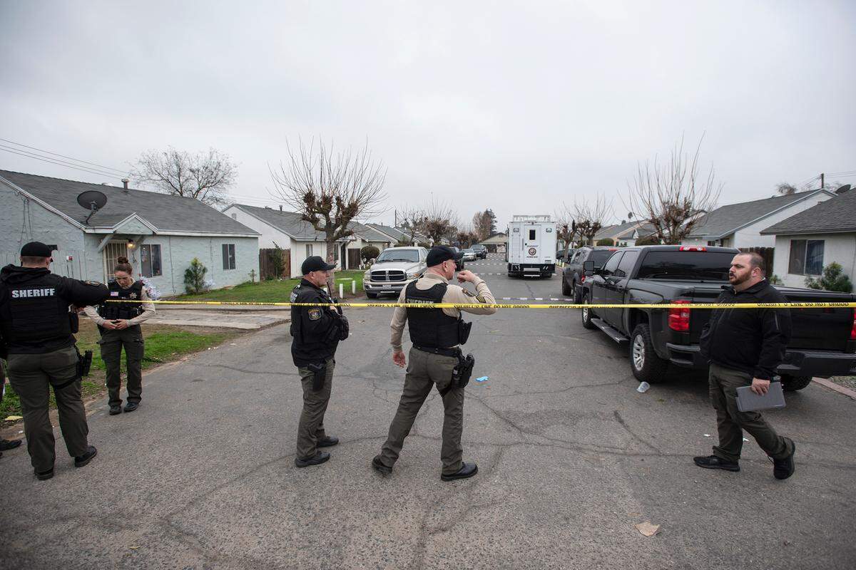 Stanislaus County Sheriff deputies investigate an assault on Adkinson Way in Modesto, Calif., on Monday, Dec. 20, 2021.