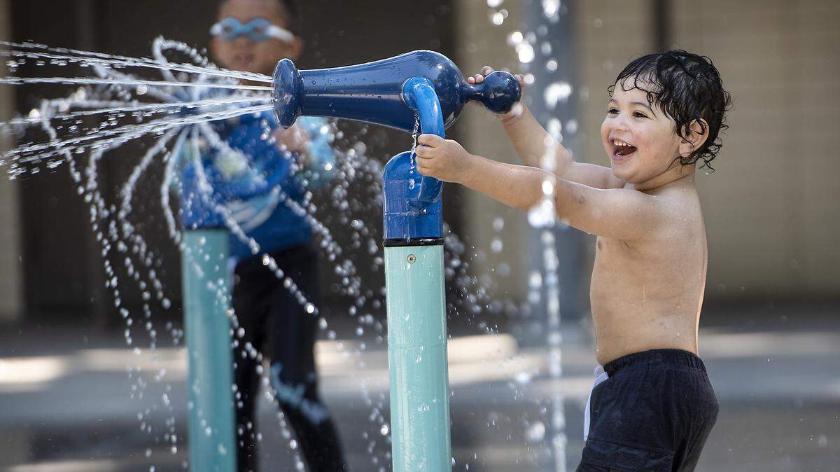 Santi Sanchez, 2, plays at the water park in Graceada Park in Modesto Calif., Wednesday, July 10, 2019.
