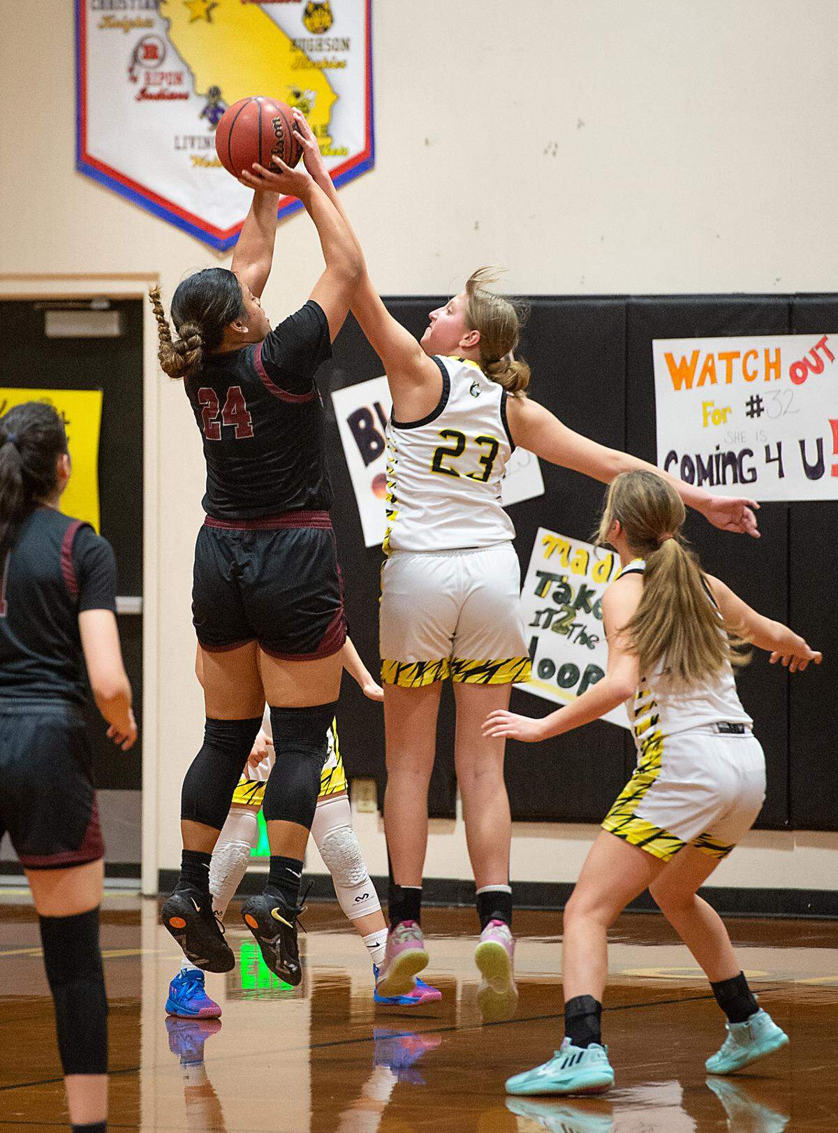 Hughson’s Gracie Quillen blocks the shot of Riverbank’s Rayne Tago during the Trans-Valley League game in Hughson, Calif., Tuesday, Jan. 31, 2023. Hughson won the game 53-41.