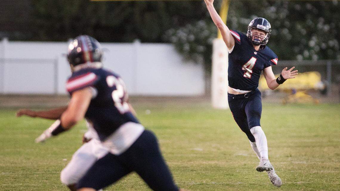 Modesto Christian quarterback Hayden Sauser throws a pass to Isaac Schinmann during the non-league game with El Capitan in Salida, Calif., on Friday, September 7, 2018. Modesto Christian won the game 47-8.