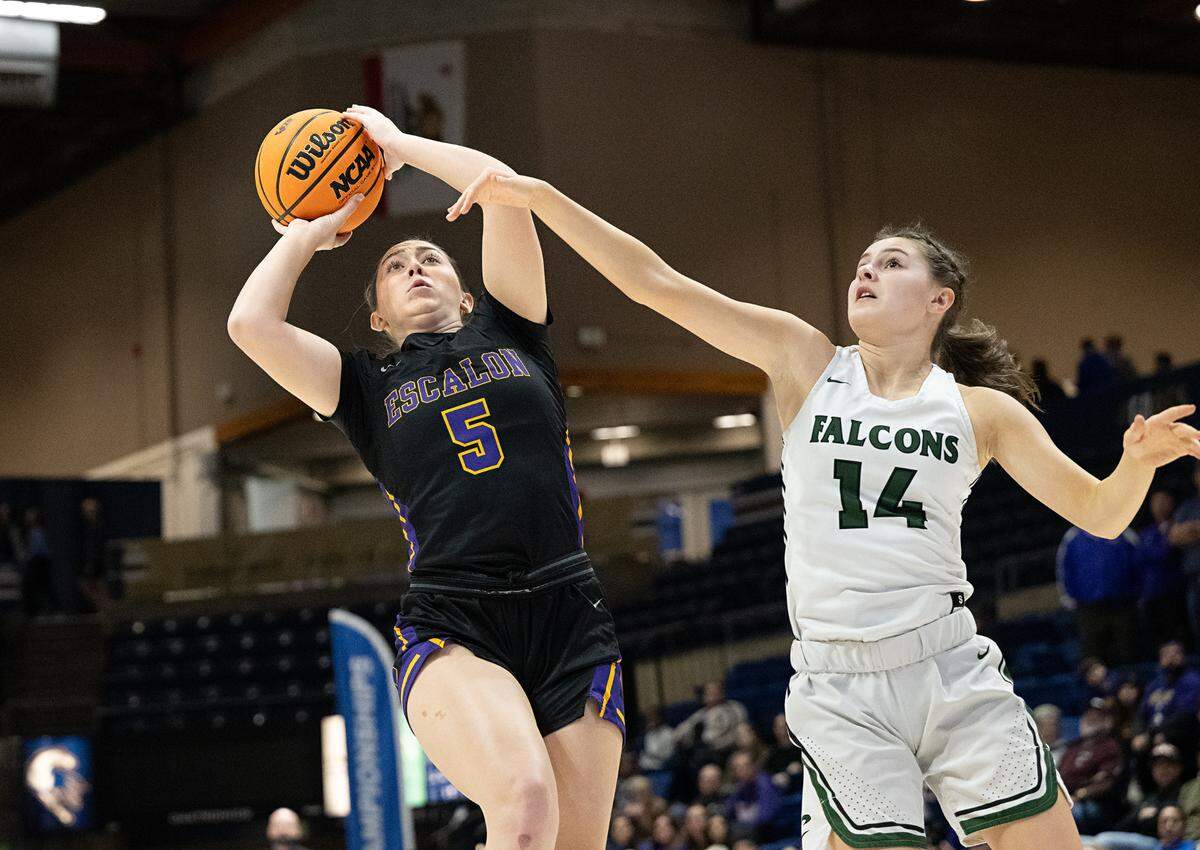 Escalon’s Macie Vickers scores past Colfax defender Laurlyn Massick during the Sac-Joaquin Section Division IV championship game at UC Davis in Davis, Calif., Friday, Feb. 23, 2024.