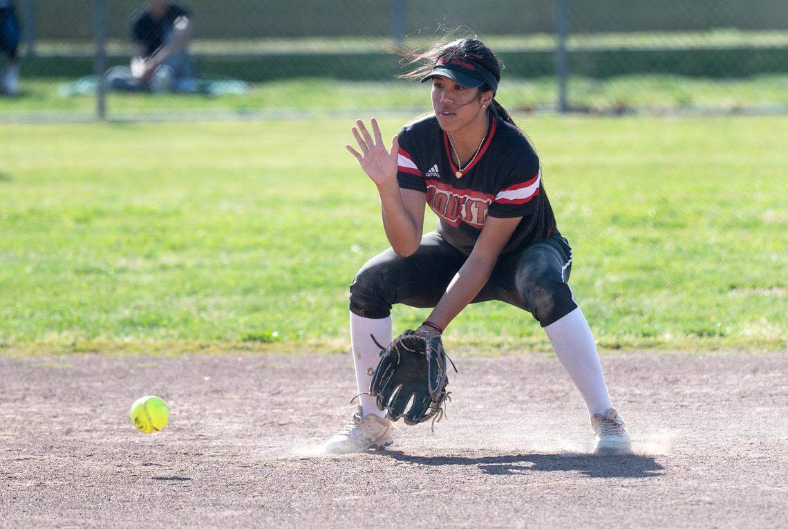 Modesto’s Dasia Guzman fields a ground ball during the Central California Athletic League game with Enochs in Modesto, Calif., Tuesday, April 18, 2023.