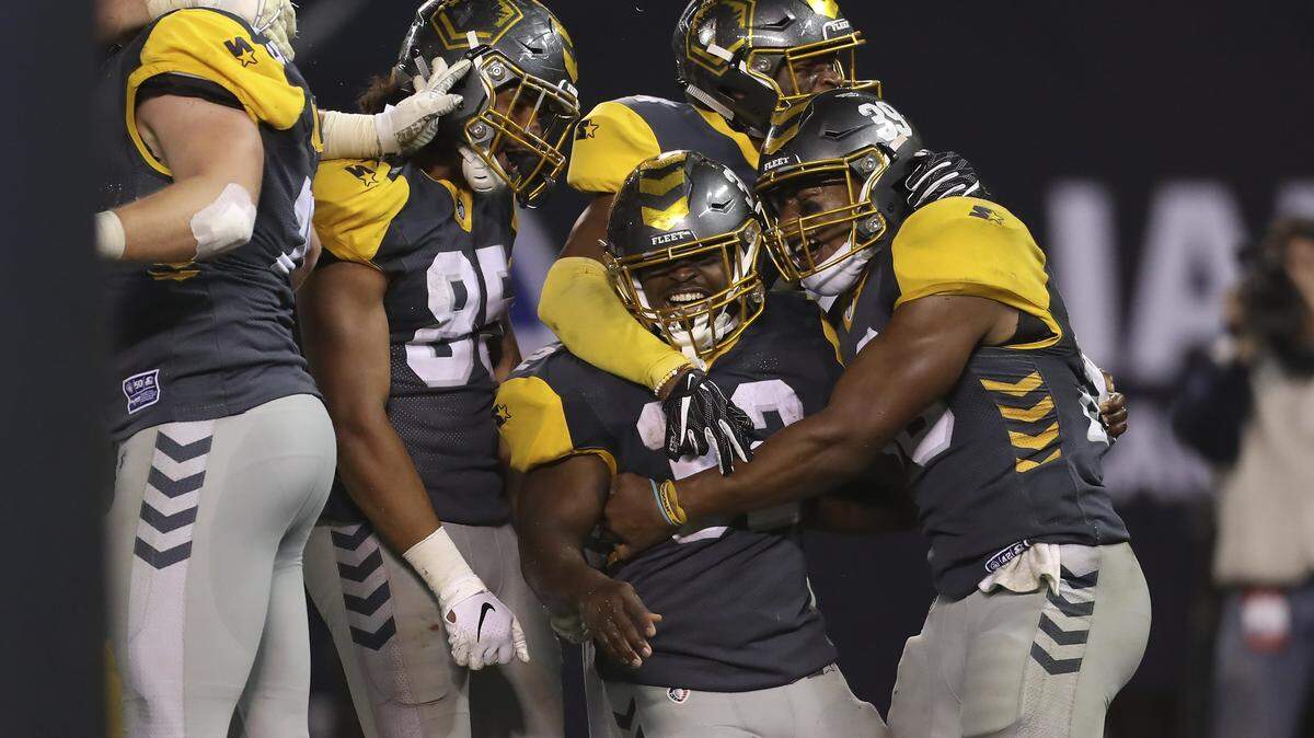 San Diego Fleet running back Ja’Quan Gardner (32) celebrates after his rushing touchdown with San Diego Fleet running back Terrell Watson (39) and San Diego Fleet tight end Marcus Baugh (85) in the second half of an AAF football game between the Atlanta Legends and the San Diego Fleet, Sunday, Feb. 17, 2019, at SDCCU Stadium in San Diego, Calif. (Peter Joneleit via AP Photo)