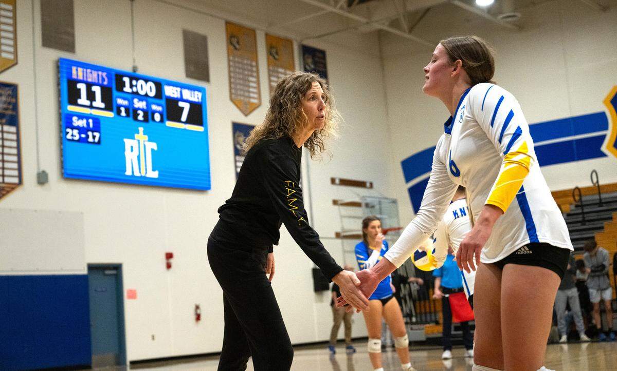 Ripon Christian coach Kayla Kootstra greets Morgan Schenk coming off the court during the CIF State Division 4 playoff game with West Valley at Ripon Christian High School in Ripon, Tuesday, Nov. 12, 2024.