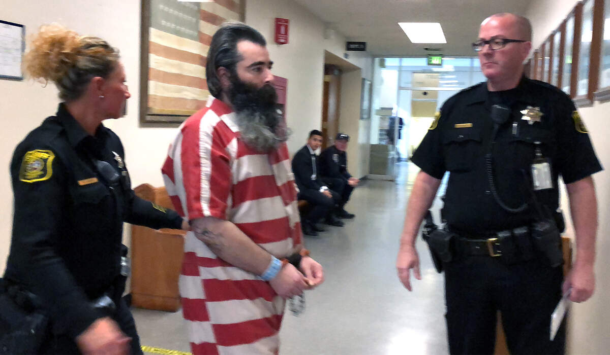 Defendant David Machado is ushered across a hallway Tuesday Feb. 5, 2019, at the Stanislaus Superior Courthouse in Modesto, California. Machado is accused of murder in the shooting of Stanislaus County Sheriff’s Deputy Dennis Wallace.