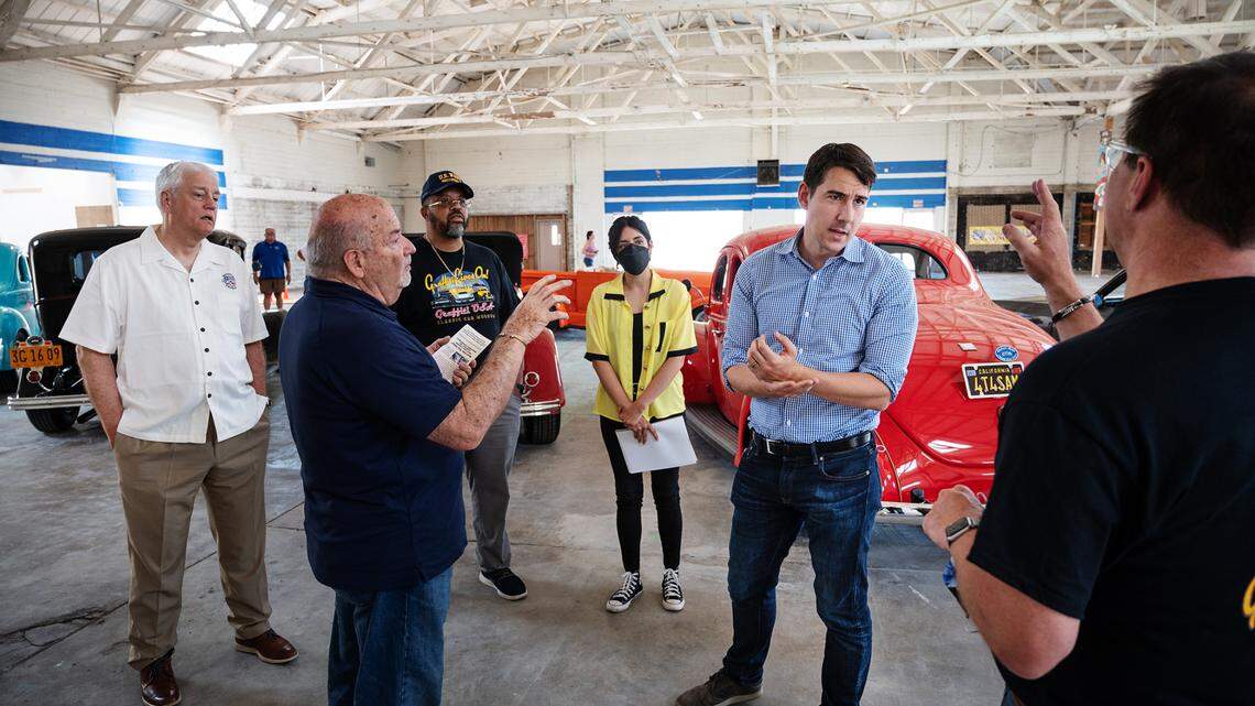 Congressman Josh Harder talks with members of the museum board at the future Graffiti USA Classic Car Museum in Modesto, Calif., on Tuesday, June 1, 2021.