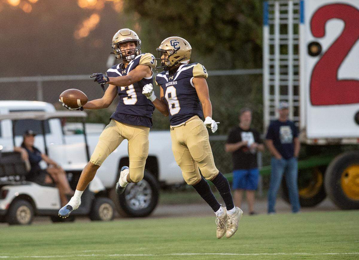 Central Catholic receiver Trace Hernandez (3) and teammate Sebastian Guzman celebrate a touchdown during the non-league game with St. Mary’s at Central Catholic High School in Modesto, Calif., on Friday, September 2, 2022.