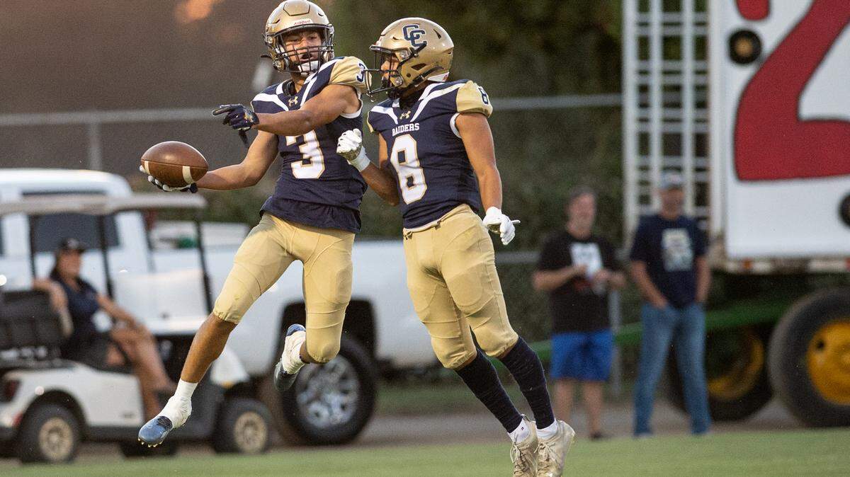 Central Catholic receiver Trace Hernandez (3) and teammate Sebastian Guzman celebrate a touchdown during the non-league game with St. Mary’s at Central Catholic High School in Modesto, Calif., on Friday, September 2, 2022.