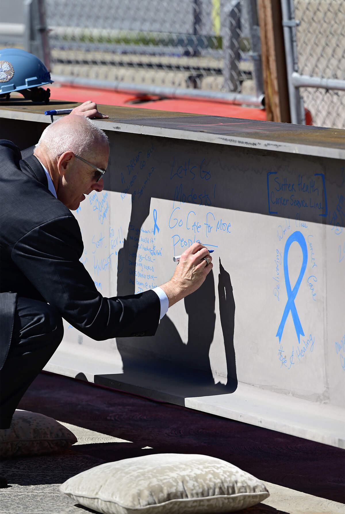 Sutter CEO Warner Thomas signs the steel beam at the Modesto Advanced Cancer Center and Care Complex under construction at Sutter Memorial Medical Center in Modesto, July 17, 2026.