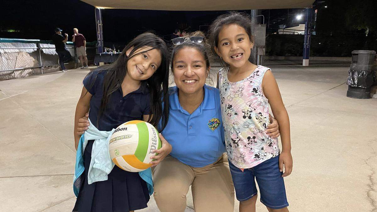 Modesto Nuts General Manager Veronica Hernandez takes a picture with young fans at an event.