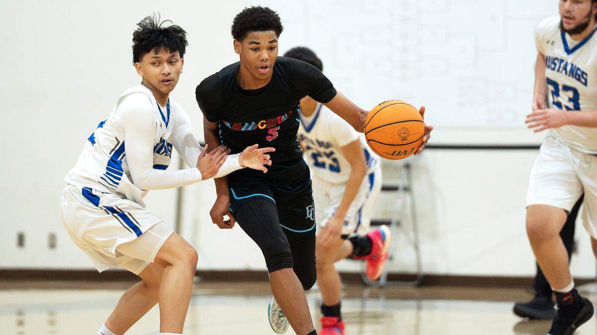 El Capitan guard Anthony Jones dribbles past a Mountain House defender during the Holiday Hoop Classic game at Modesto Christian High School in Salida, Calif. on Thursday, Dec. 26, 2024.