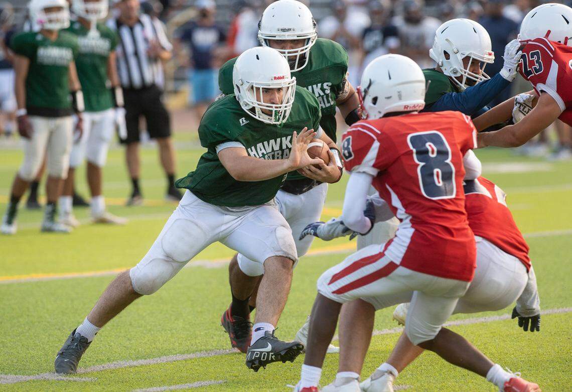 Central Valley fullback Andrew Torres attacks the Beyer defense during a pre-season scrimmage at Downey High School in Modesto, Calif., on Friday, Aug. 13, 2021.