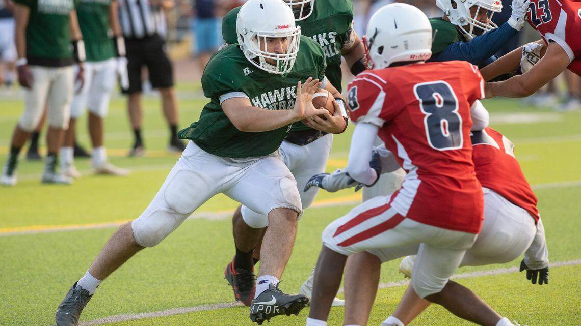 Central Valley fullback Andrew Torres attacks the Beyer defense during a pre-season scrimmage at Downey High School in Modesto, Calif., on Friday, Aug. 13, 2021.