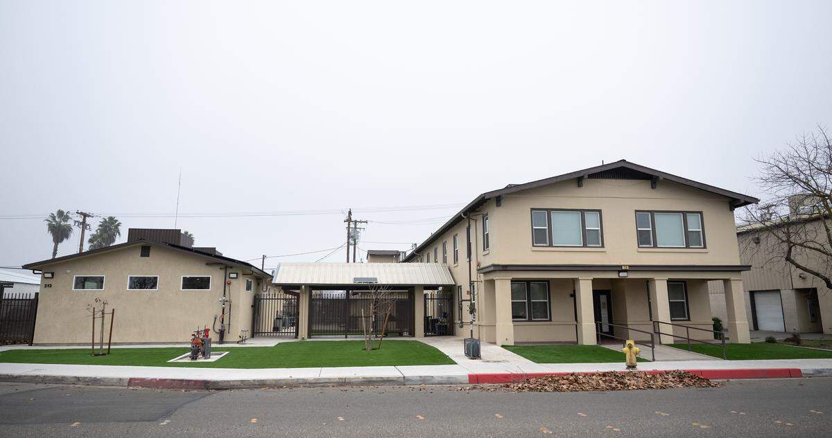 The We Care shelter with a remodeled kitchen and dining room building at left.