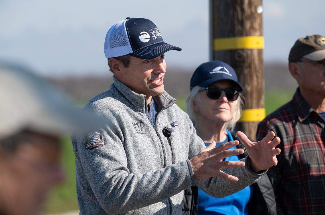 California Natural Resources Agency Secretary Wade Crowfoot and other officials viewed a demonstration of the TID groundwater recharge program at the Gemperle family farm near Keyes, Calif., Wednesday, Jan. 18, 2023.