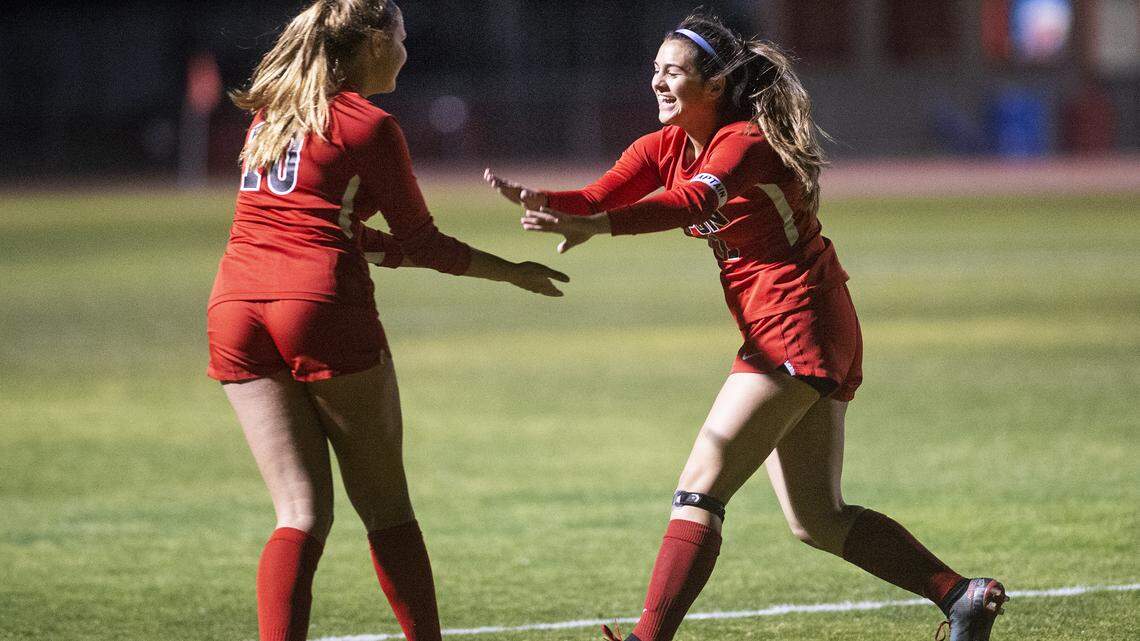 Ripon’s Ariana Scholten, left, and Kailey Tijero, right, celebrate a goal during the CIF Sac-Joaquin Section Division IV playoff game with Marysville in Ripon, Calif., on Wednesday, Feb. 19, 2020.