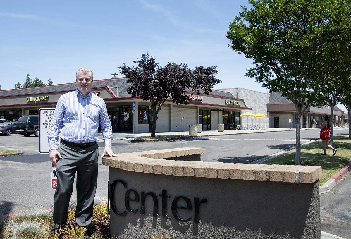 Graceada Partners Principal Joe Muratore stands in front of Century Center, which his Modesto-based real estate investment group purchased last year.