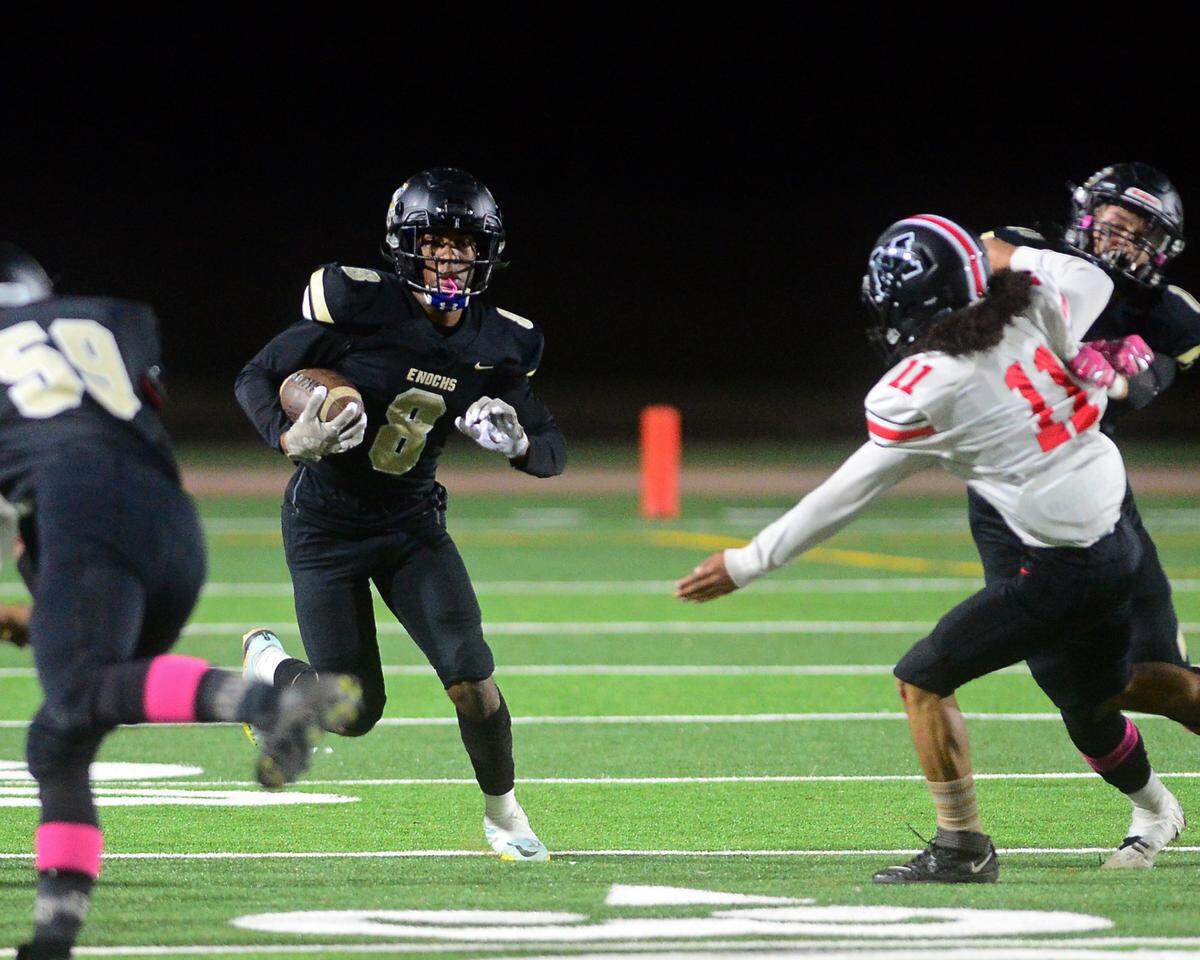 Enochs High’s Marley Okoro returns a kickoff during a game against Modesto at Johansen High School in Modesto, Calif., on Oct. 28, 2022.