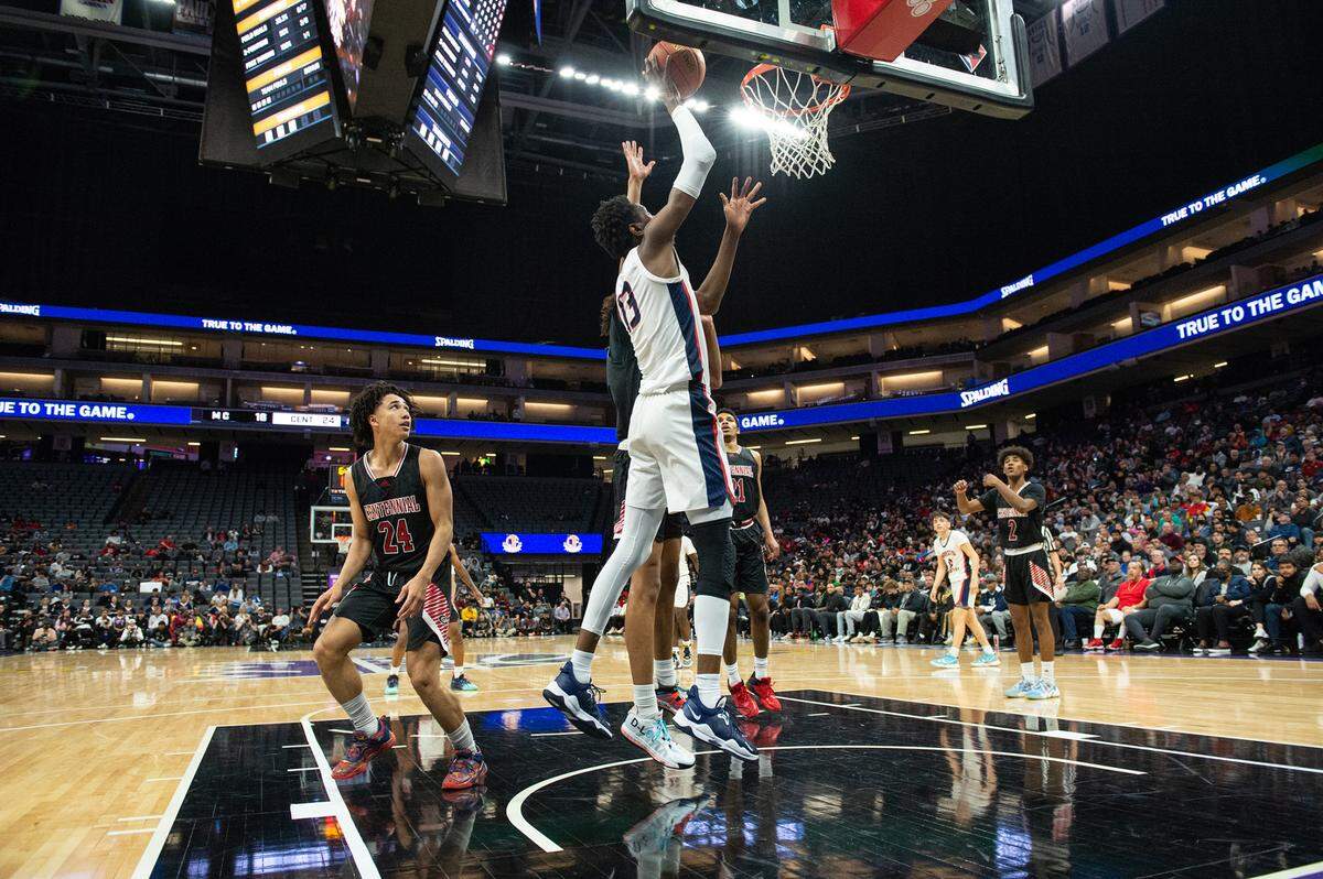 Modesto Christian’s Prince Oseya (13) attempts a basket during the boys Open Division CIF State Basketball Championship game with Centennial at Golden 1 Center in Sacramento, Calif., on Saturday, March 12, 2022.