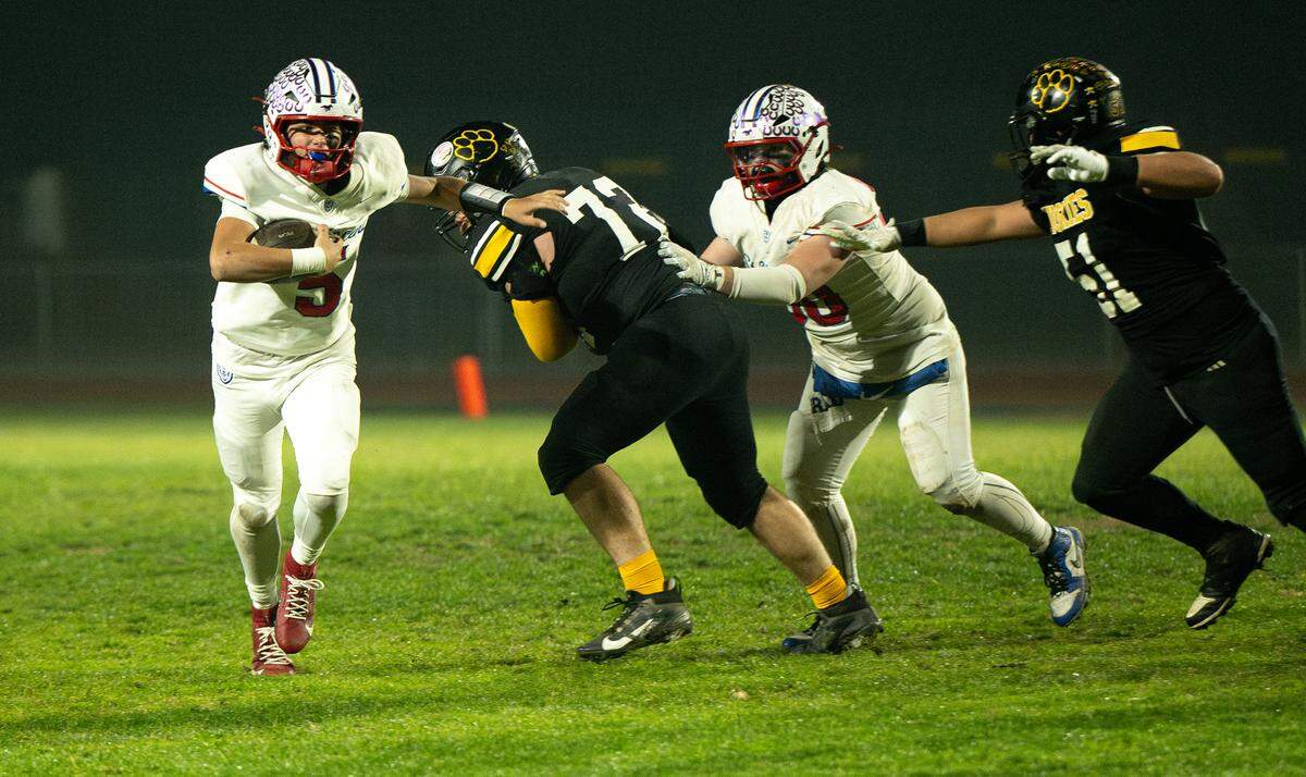 St. Vincent quarterback Gabe Casanovas runs the ball during the CIF Northern California Division 4-AA Bowl Game with Hughson in Hughson, Friday, Dec. 6, 2024.