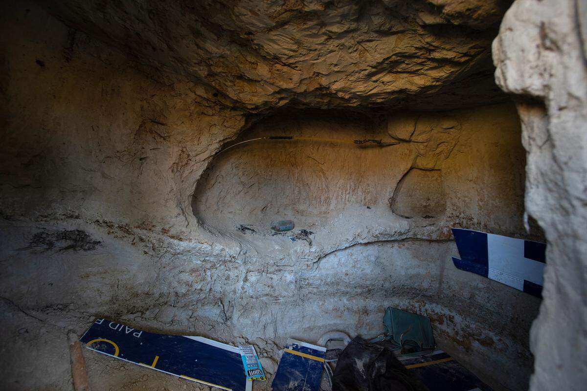 Homeless people have been digging caves along the south side of the Tuolumne River near Crater Avenue in west Modesto, Calif., Thursday, Oct. 27, 2022.