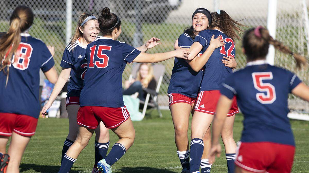 Beyer’s Bryanna Herrera is mobbed by her teammates after scoring a goal during the Western Athletic Conference game with Johansen at Mary Grogan Park in Modesto, Calif., Tuesday, Feb. 6, 2019.