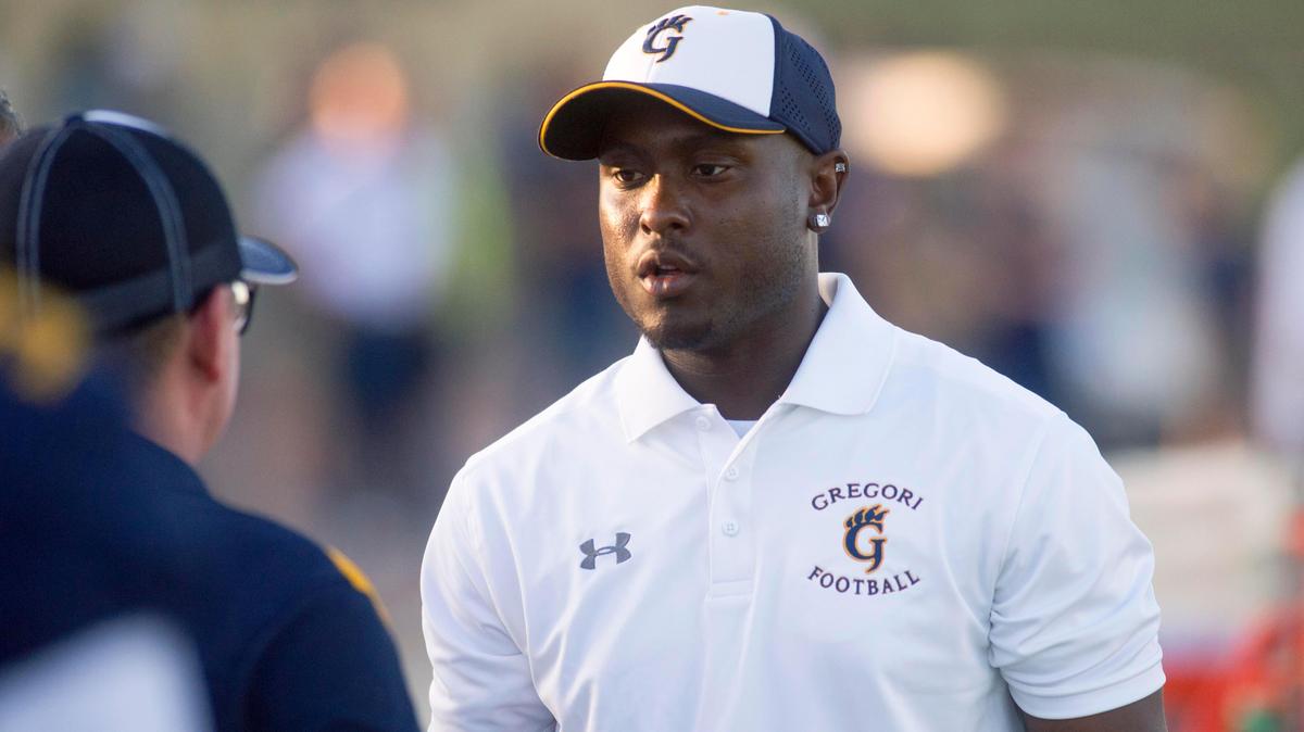 Gregori head coach Lamar Wallace talks to his other coaches before a game between Gregori and Buhach Colony at Gregori High School in Modesto California on August 23, 2019.
