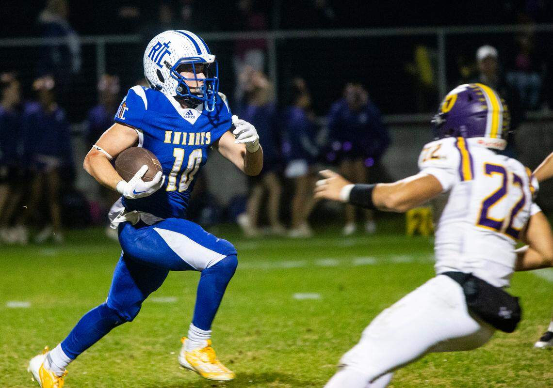 Ripon Christian’s Brady Grondz (10) gains yards during the first half of play in the Sac-Joaquin Section Division VII-A Championship against Orestimba at Ripon Christian High School on Friday, Nov. 17, 2023.