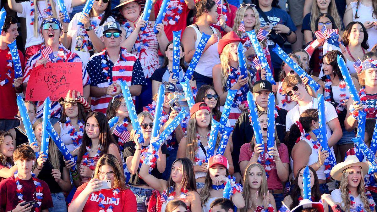 The Hughson High School Student section wears patriotic attire while cheering during a game between Hughson High School and Central Valley High School at Hughson High School in Hughson California on August 25, 2023.