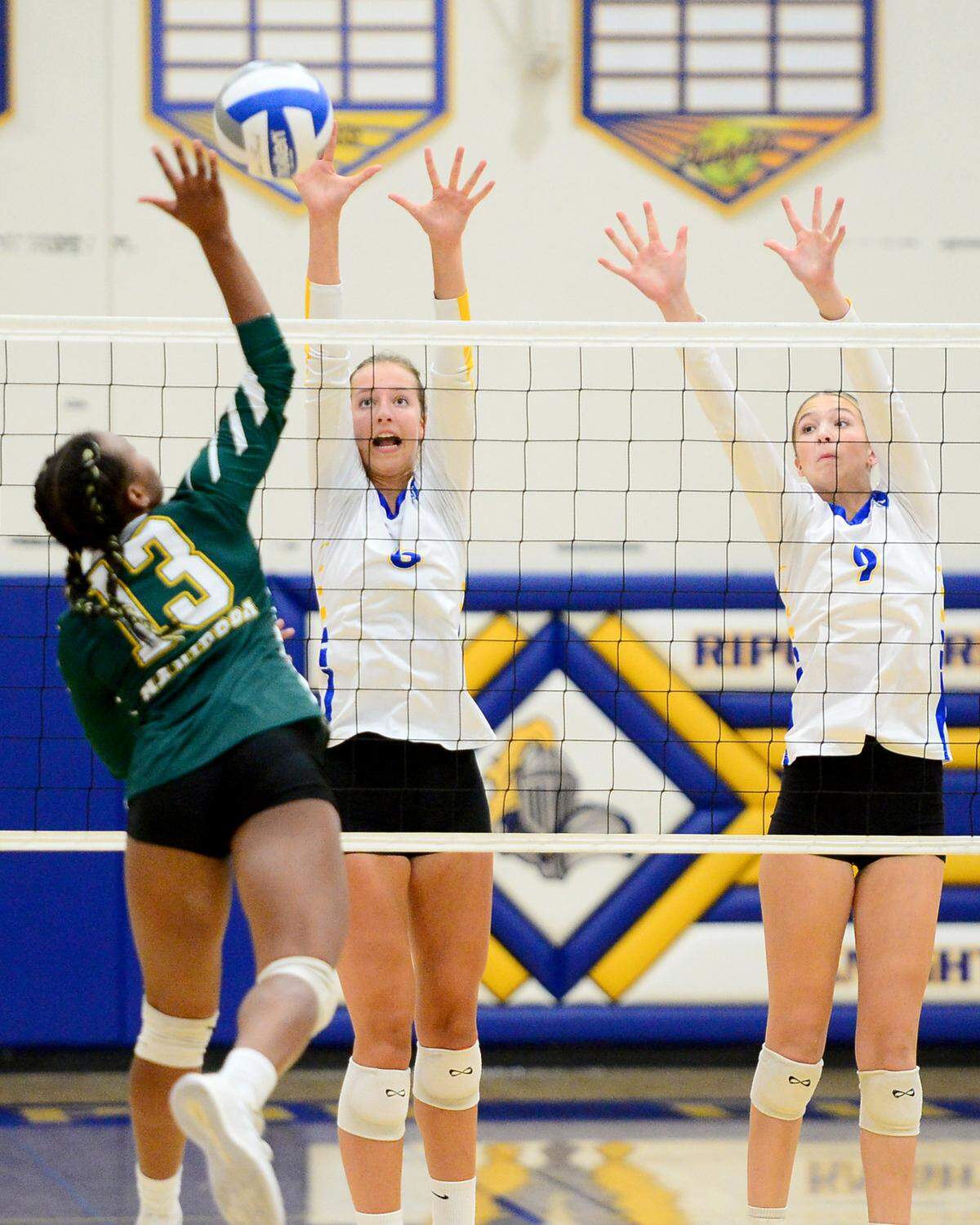 Ripon Chrisitan’s Megan Weststeyn (left) and Brynn Bohn (right) try to block a ball during a game between Ripon Christian and Mariposa at Ripon Christian High School in Ripon California on September 19, 2023.