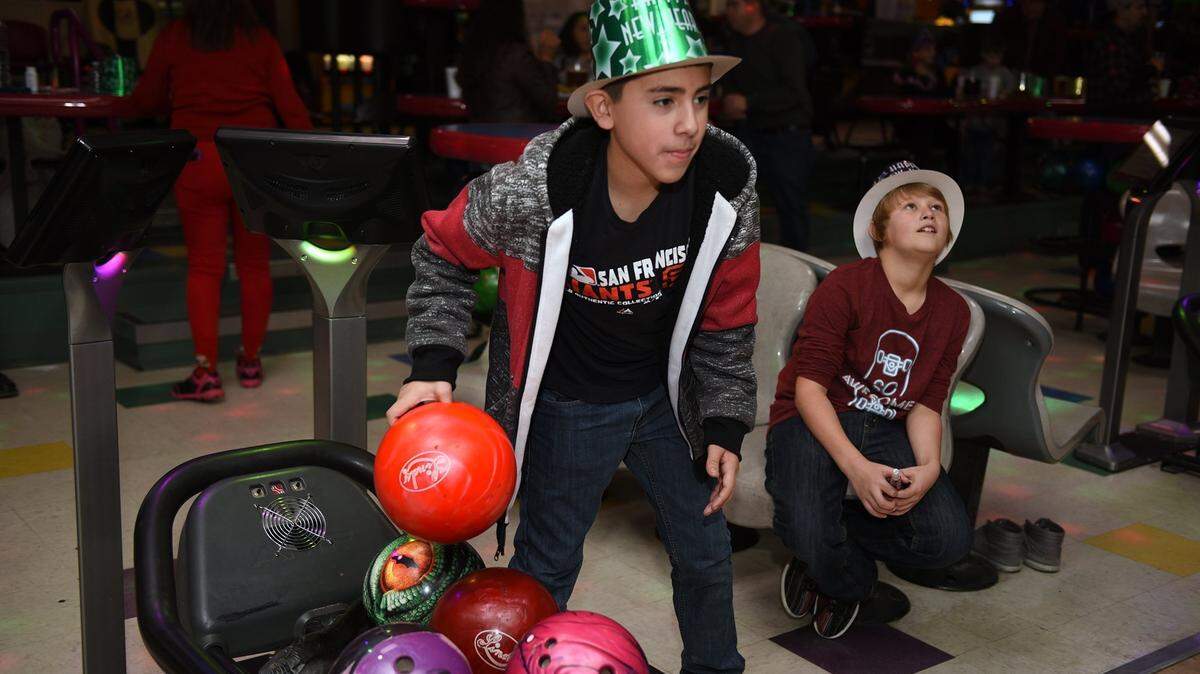 Youths enjoy the family party at the 2016 New Year’s Eve event at Yosemite Lanes in Modesto.