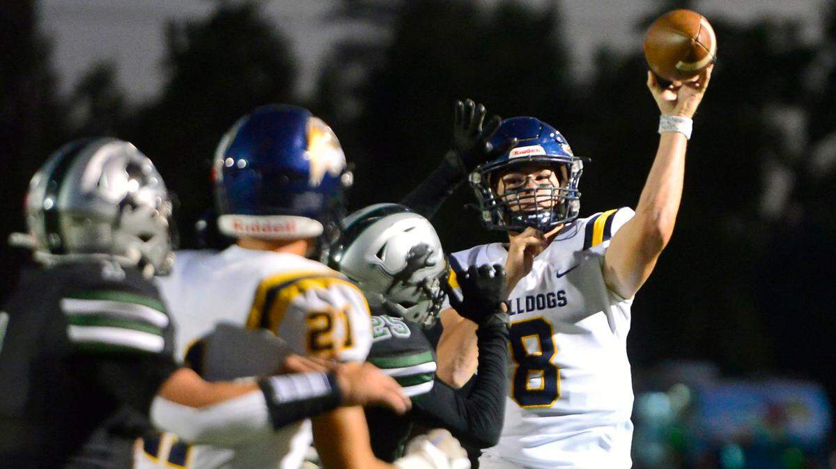 Turlock quarterback Cole Gilbert throws a pass to the end zone during a game between Turlock High School and Pitman High School at Turlock High on Sept. 30, 2022.