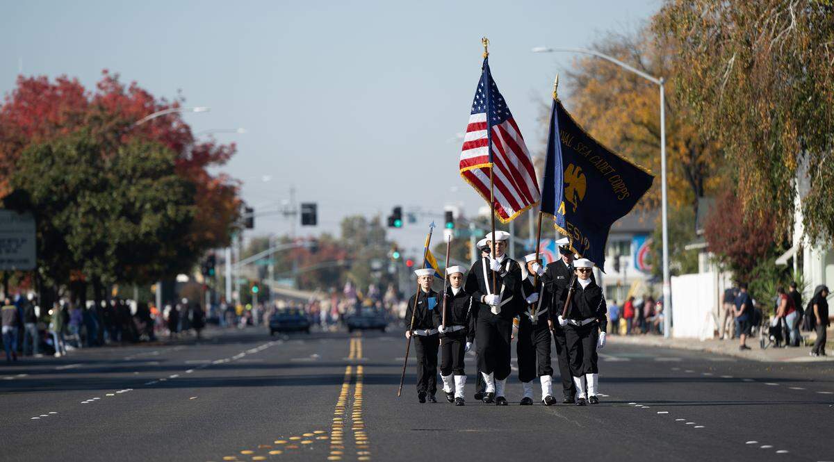 Naval Sea Cadets walk down Needham Street during the Modesto Veterans Day Parade in Modesto, Calif., Saturday, Nov. 11, 2023.