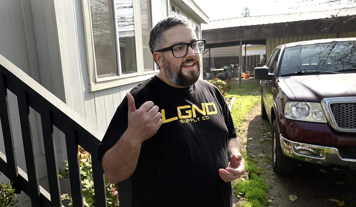 Travis Davis at his Cowan Tract home in unincorporated Stanislaus County, Tuesday, Feb. 3, 2026. Davis’ family drinks bottled water instead of drinking from their well.