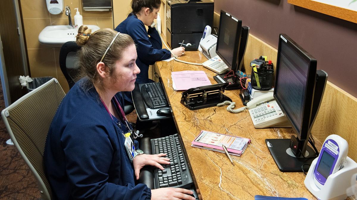 Registered nurse Tiffany Burnett works on charting at Doctors Medical Center in Modesto, Calif., on Tuesday, April 17, 2018.