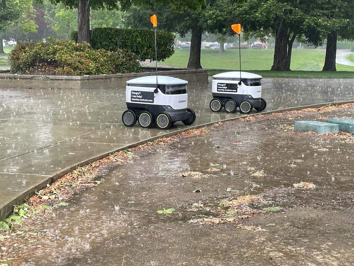Save Mart’s little rolling delivery robots get drenched in Coffee Claratina Neighborhood Park in north Modesto on Thursday, April 21, 2022.