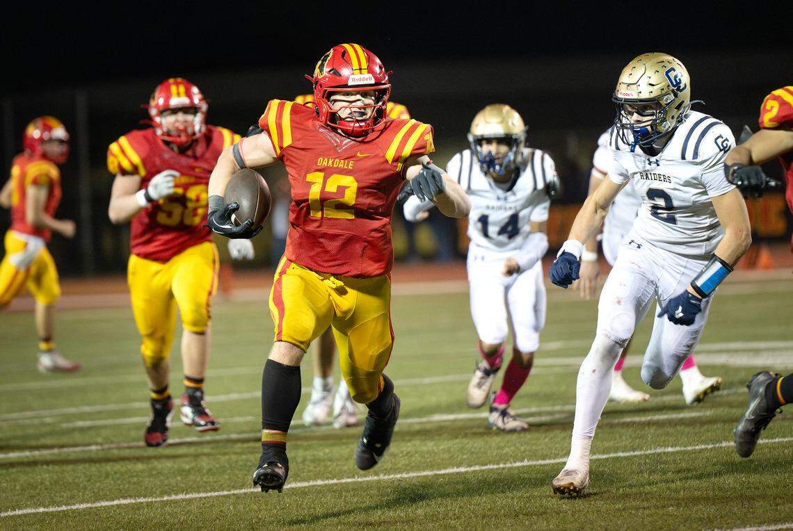 Oakdale’s Wes Burford breaks out on a touchdown run during the Valley Oak League game with Central Catholic in Oakdale, Friday, Oct. 17, 2025.