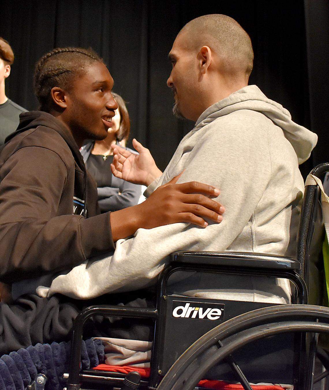 Lawrence Harris, a junior who portrayed the drunk driver during the Every 15 Minutes DUI awareness and prevention at Downey High this week, talks with Manuel Russ after an assembly in the school auditorium on Wednesday, April 3, 2019. Lawrence played on a football team with one of Russ’ daughters.