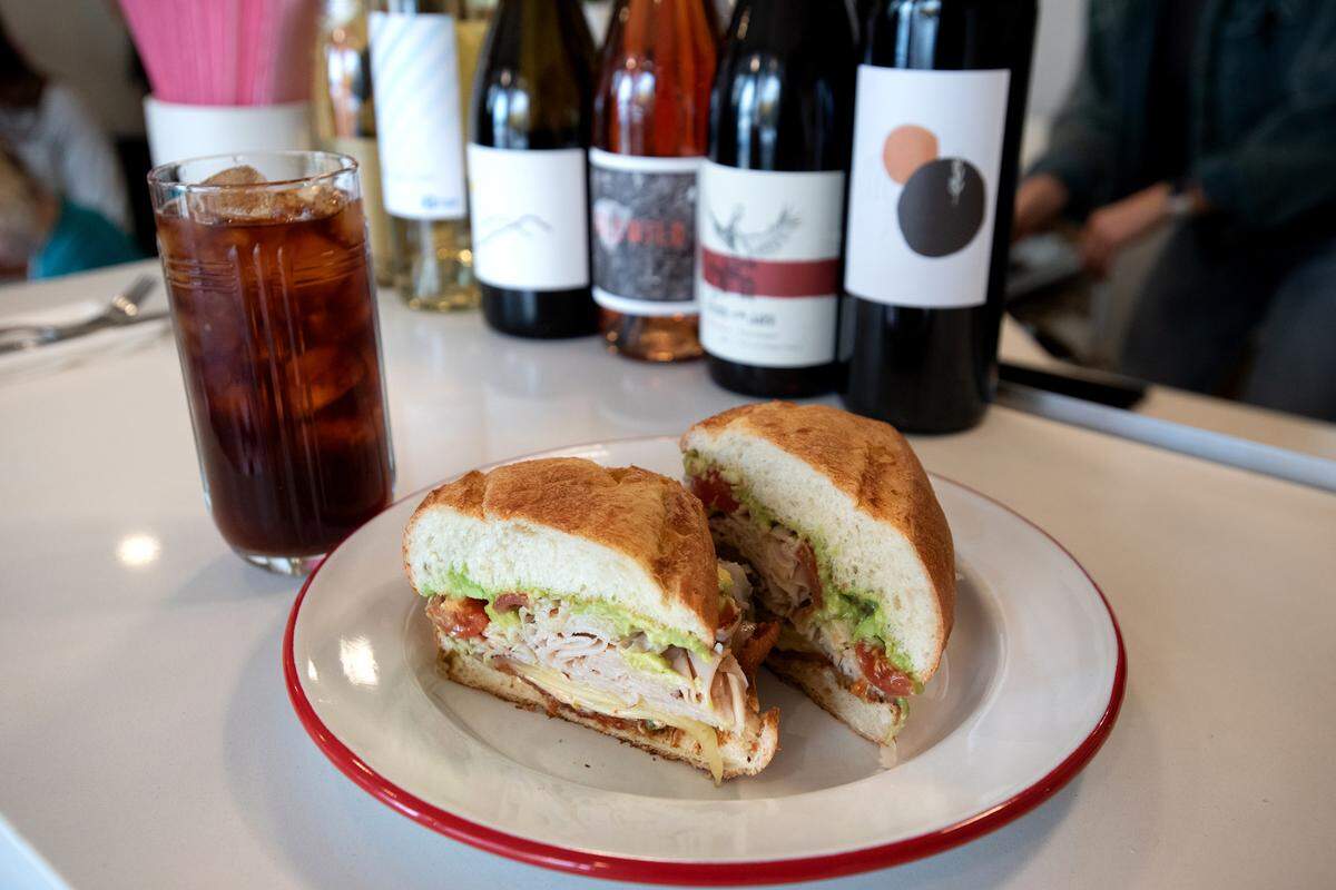 Three P+ H sandwich (roasted turkey, pepper bacon, pepper jack cheese, tomato, jalapeño, chipotle aioli, bolillo bread) and iced tea at, Lucille cafe in downtown Modesto, Calif., Friday, Feb. 3, 2023.