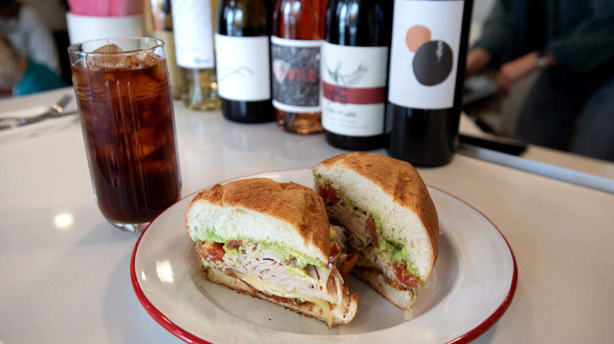 Three P+ H sandwich (roasted turkey, pepper bacon, pepper jack cheese, tomato, jalapeño, chipotle aioli, bolillo bread) and iced tea at, Lucille cafe in downtown Modesto.