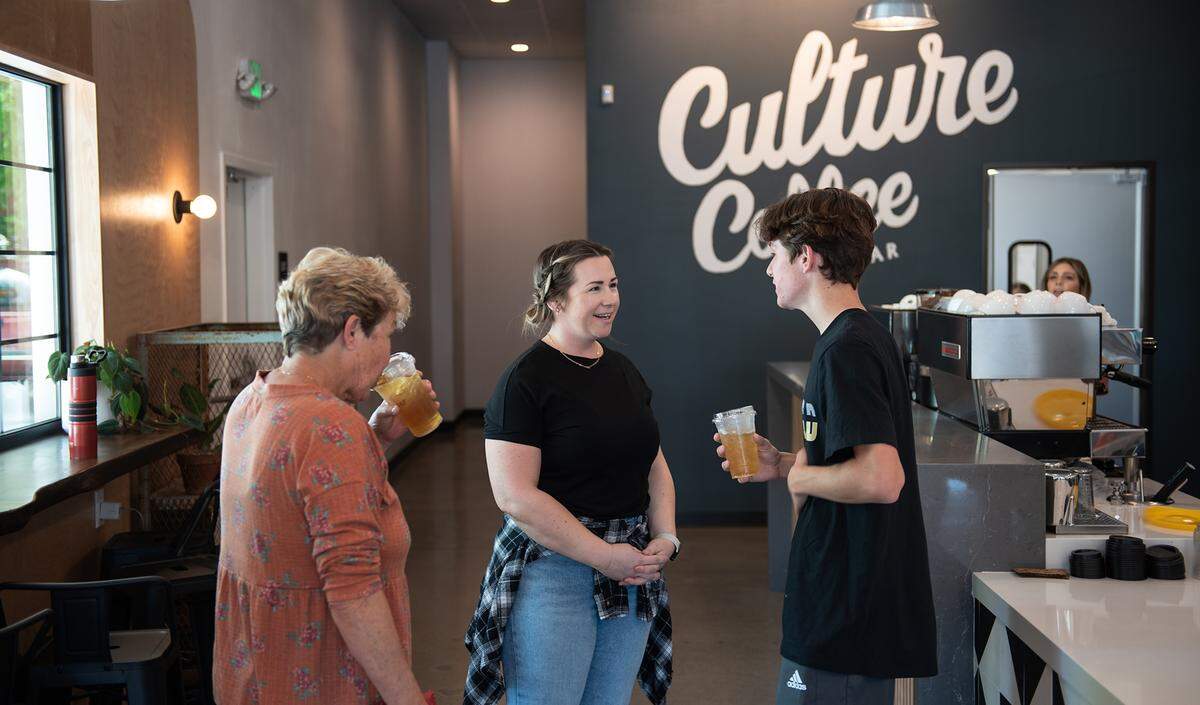 Jamie Griswold talks with her son Dane, 14, her mother-in-law Margaret Costa at Culture Coffee Bar on McHenry Avenue in Modesto, Calif., on Tuesday, March 22, 2022.
