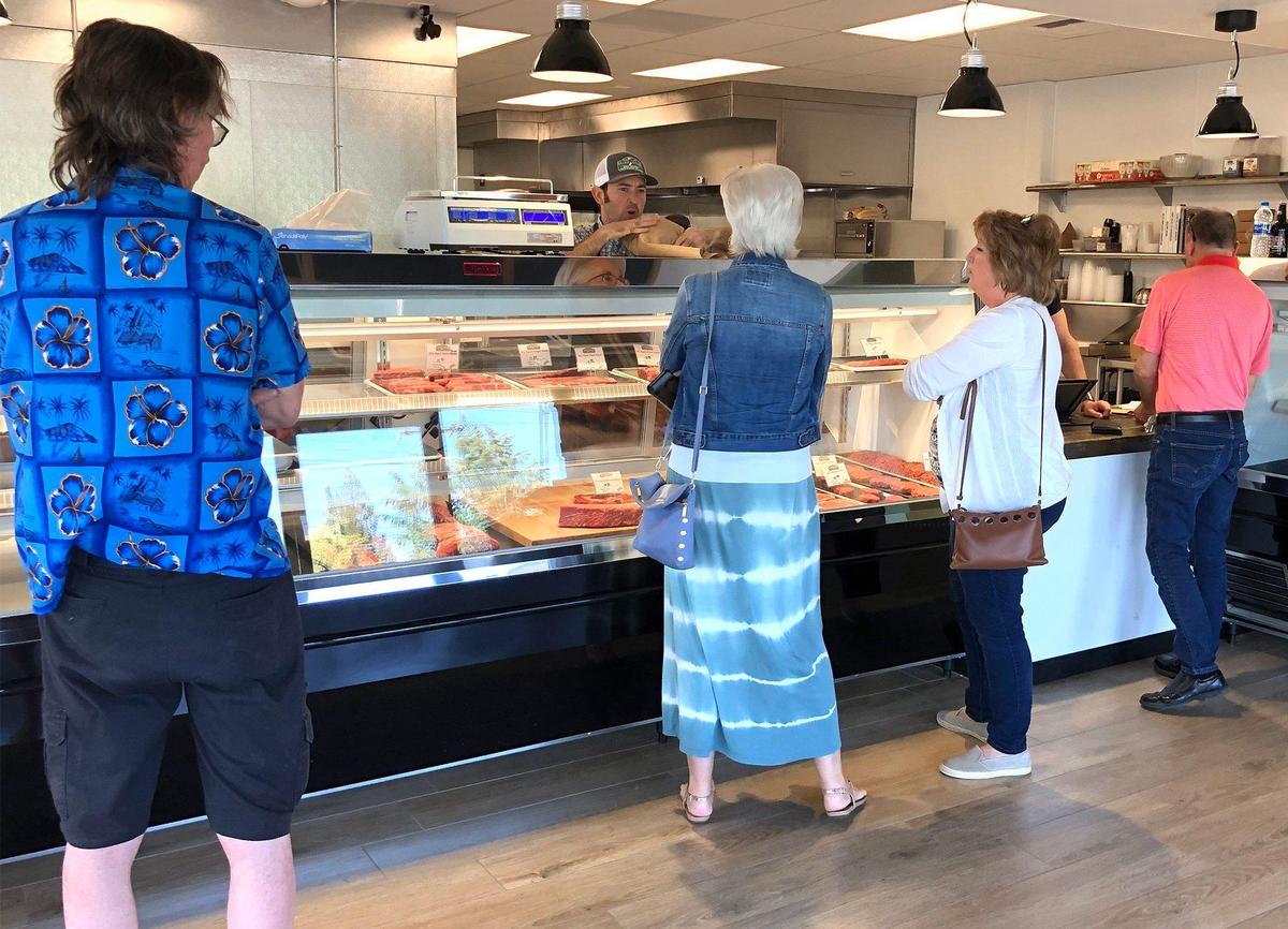 Customers are pictured Thursday May 30, 2019 at The Village Butcher in McHenry Village in Modesto, Calif.