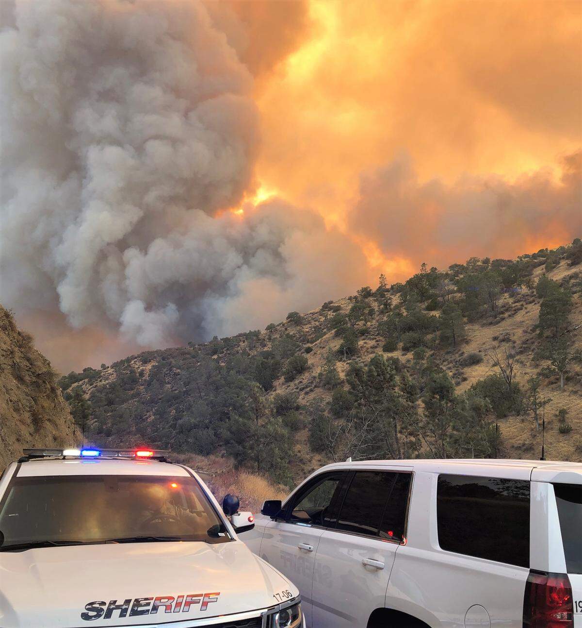 Flames from the Canyon Zone Fire could be seen along Del Puerto Canyon Road at 14 Mile marker on Monday, Aug. 17, 2020.