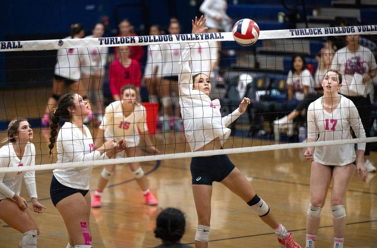 Turlock’s Amaya Morales, middle, returns the ball during the Central California Athletic League match with Pitman at Turlock High School in Turlock, Calif., Tuesday Oct. 8, 2024.