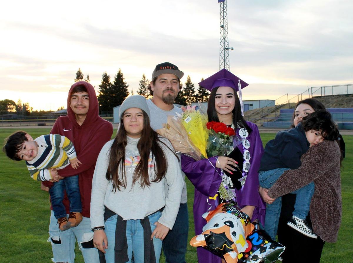 Melchor Leyva Fong, 31, of Modesto was killed after suspects in a stolen car crashed into the Tacos Vallarta taco truck in downtown Modesto during a police pursuit. Leyva Fong (pictured center) with his family and niece Aylin Leyva Sanchez (third from right) at her graduation in May from Denair Charter Academy.
